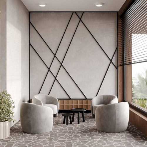 A modern sitting area with four gray chairs around small tables, a potted plant, decorative wall patterns, and large windows.