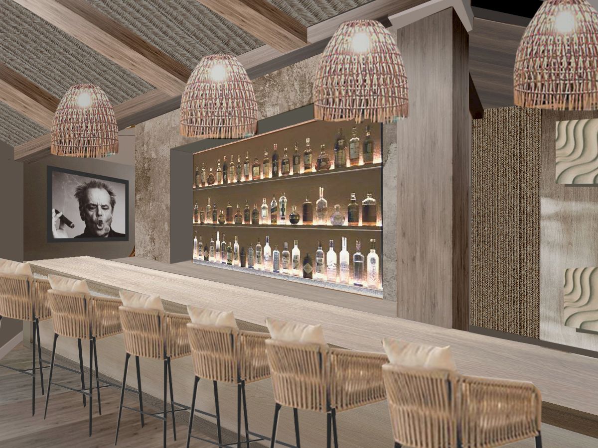 The image shows a modern bar interior with a long counter, wicker chairs, and pendant lights, alongside shelves of bottles and decorative art.