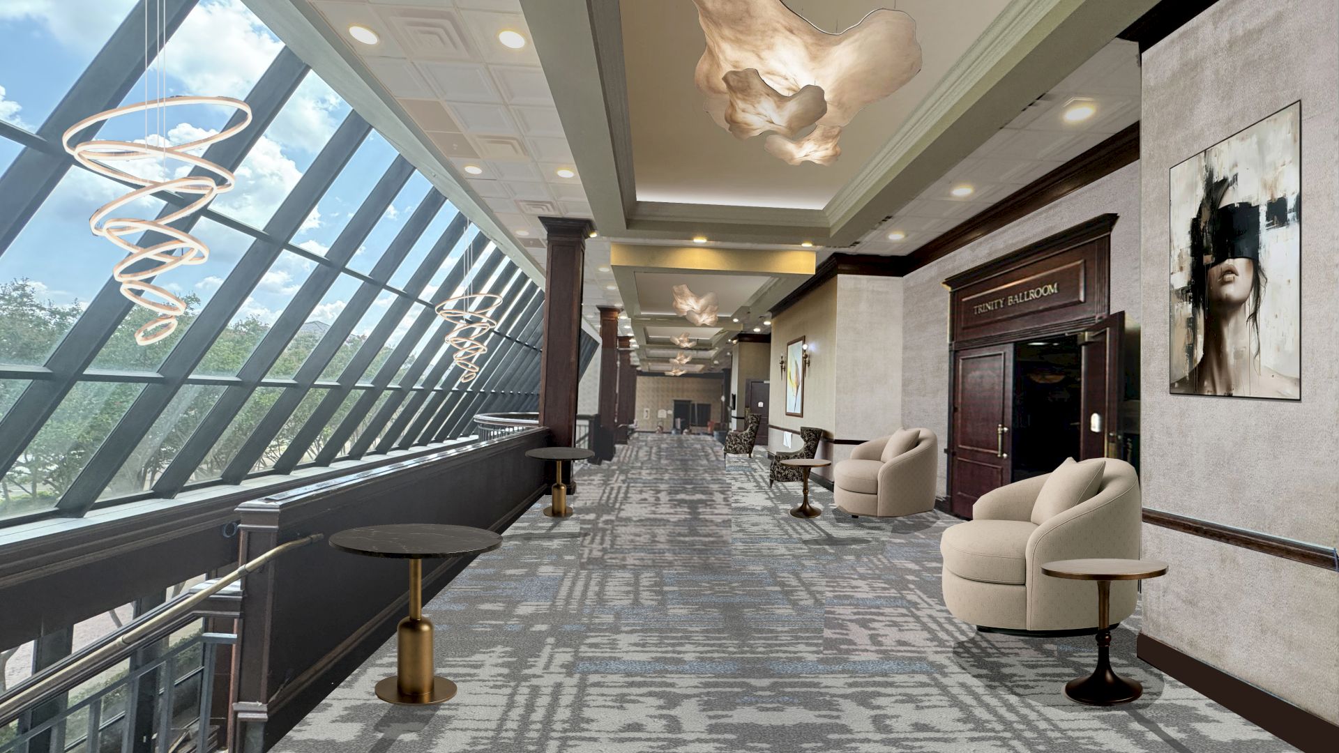 An upscale hotel hallway with large windows, spiral pendant lights, a ceiling rib-like sculpture, artwork, and beige seating along a patterned carpet.